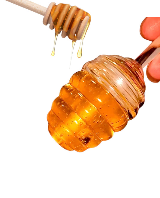 Honey Turmeric Lip Gloss by Whippedwonderland Skincare in its lip gloss packaging