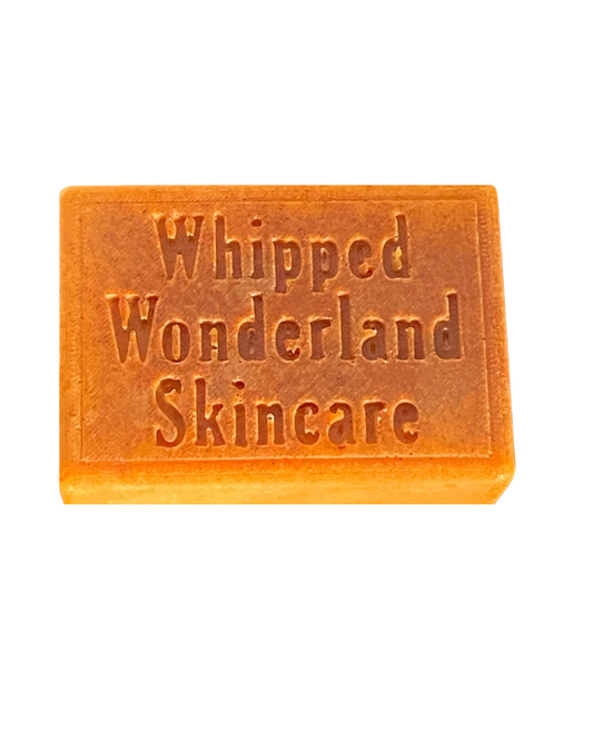 Turmeric Goat's Milk Soap Bar by Whippedwonderland Skincare displayed in its product packaging